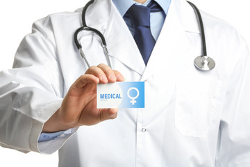 Wall Mural - Gynecologist holding business card isolated on white, closeup. Medical service