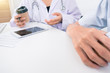 © RAYBON - Doctor consulting patient hands closeup. medical service, consultation or education, healthy