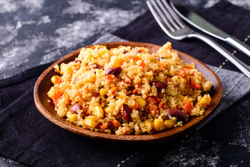 Poster - Mexican black bean corn quinoa salad in clay bowl top view, copy space.