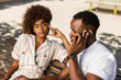 © Samuel B. - Outdoor protrait of black african american couple -  Girl bored watcing boyfriend on phone