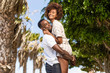 © Samuel B. - Outdoor protrait of black african american couple - Guy carrying girfriend on his back
