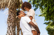 © Samuel B. - Outdoor protrait of black african american couple - Guy carrying girfriend on his back