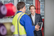 © Westend61 - Businessman with tablet and worker in factory
