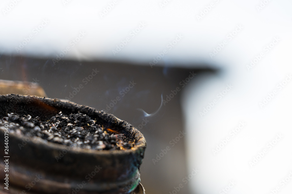 Bee Fure Beekeeper is making a fire in bee smoker. Preparation to Honey Harvest ...