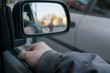 © Евгений Медведев - a man's hand on the car door on the background of a female silhouette in the mirror of the rear view mirror