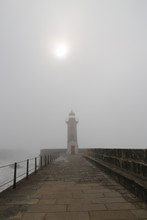 Lighthouse In The Fog