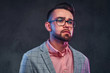 © Fxquadro - Portrait of attractive pensive man in checkered blazer, pink shirt and glasses.