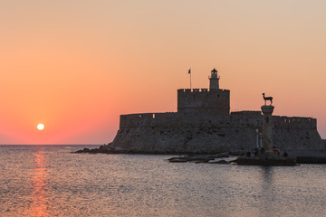 Wall Mural - sunrise in Mandraki harbour. Rhodes, Greece