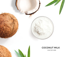 Creative Layout Made Of Coconut And Coconut Milk On White Background. Flat Lay. Food Concept. Macro  Concept.