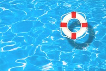 Life Preserver Floating In A Clear Pool Water
