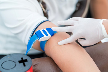 Nurse collecting a blood from patient in hospital