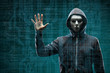 © Acronym - Dangerous hacker over abstract digital background with binary code. Obscured dark face in mask and hood. Data thief, internet attack, darknet fraud, virtual reality and cyber security.