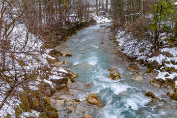 Wall Mural - alpine stream at winter time