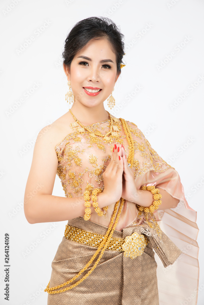 The couple Khmer take photo prewedding with wedding dress and Khmer traditional clothes in Royal Palace to prepare their wedding party on next month Stock-bilde | Adobe Stock The couple Khmer take photo prewedding with wedding dress and Khmer traditional clothes in Royal Palace to prepare their wedding party on next month Stock-bilde | Adobe Stock