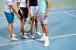 © NDABCREATIVITY - Group of healthy happy friends at the club playing tennis