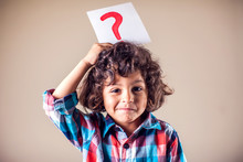 Kid Boy With Question Mark. Children, Education And Emotions Concept