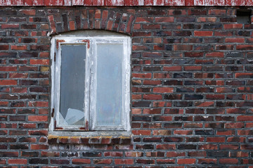 Window on brick wall on Frøya an island outside Trondheim in Norway