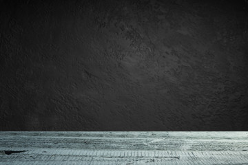 Wall Mural - cement floor in dark room with spot light. black background.