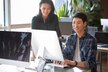 Young college students using computer