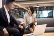 © Blue Jean Images - Young business people talking in office