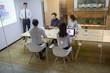 © Blue Jean Images - Business people having meeting in board room