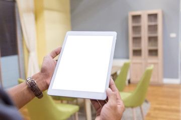Wall Mural - Mockup tablet on businessman hands empty display on home table with blur background. - Image - Image