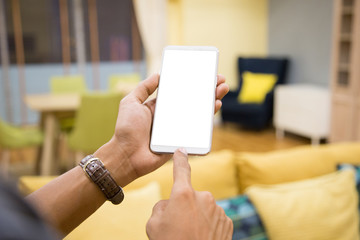 Wall Mural - Mockup smartphone on businessman hands empty display on home table with blur background. - Image - Image