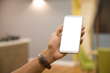 Wall Mural - Mockup smartphone on businessman hands empty display on home table with blur background. - Image - Image