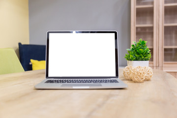 Wall Mural - laptop showing blank screen on work table front view in home- Image