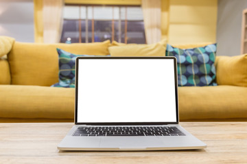 Wall Mural - laptop showing blank screen on work table front view in home- Image