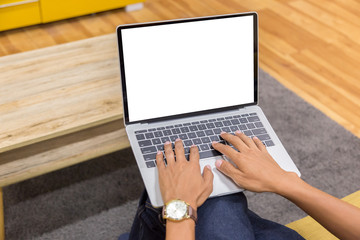 Wall Mural - Mockup image of a businessman using laptop with blank white desktop screen working in home- Image