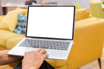 Wall Mural - Mockup image of a businessman using laptop with blank white desktop screen working in home- Image