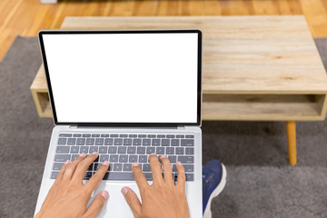 Wall Mural - Mockup image of a businessman using laptop with blank white desktop screen working in home- Image