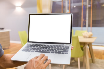 Wall Mural - Mockup image of a businessman using laptop with blank white desktop screen working in home- Image