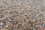 Fototapeta Kamienie - Colorful sand or pebble texture. Seamless texture on ground texture.