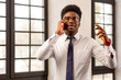 © zinkevych - Intelligent young man discussing business issues on the phone