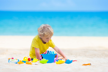 Kids playing on beach. Children play at sea.