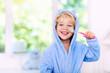 © famveldman - Child brushing teeth. Kids tooth brush.