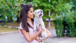 © boryanam - Beautiful Smiling Woman Hugging  Her Cute Havanese Dog .Pet and Owner Outdoor