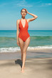 © Egor Mayer - Beautiful sexy woman in red swimwear on the beach