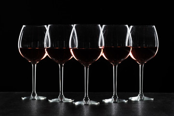 Glasses of wine in darkness