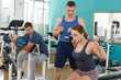 © JackF - Young woman doing exercises with barbell