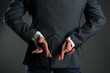 © Dmitriy - The liar business man. A man with crossed finger behind his back is giving a false promises concept. Deceitful person.