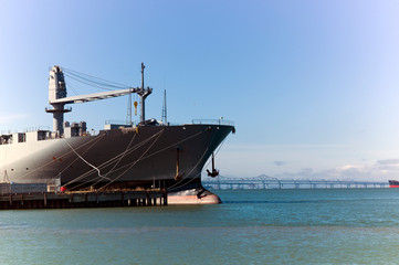 Wall Mural - gun boat ship in the bay attached to the pier