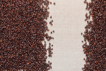  Roasted coffee beans on linea canvas with space on the right.