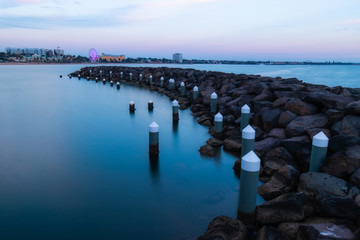 Canvas Print - rock formation and stomp at st kilda beach at dusk. melbourne, australia.
