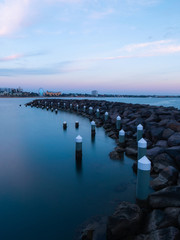 Canvas Print - rock formation and stomp at st kilda beach at dusk. melbourne, australia.