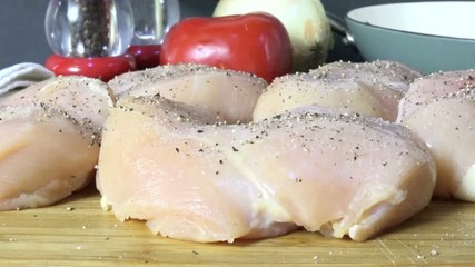 Sticker - Grinding pepper on raw chicken breasts