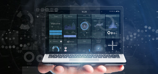 Poster - Businessman holding Laptop with business user interface data on the screen isolated on a background
