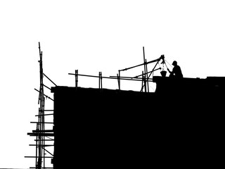 Silhouette construction worker on scaffolding